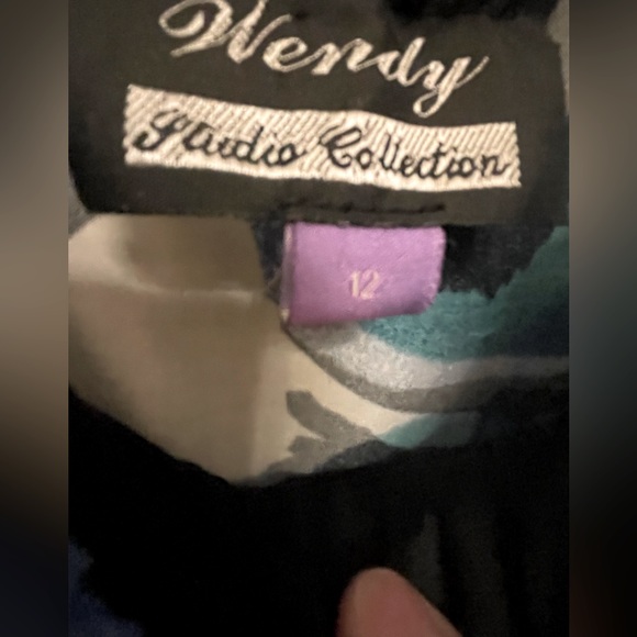 Black floral dress with rouched bodice and a black belt underneath.  Size 12. - Picture 7 of 7